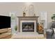 Close up of a fireplace featuring decorative mantle, wood, and white tile surround at 6051 65Th N Ave, Pinellas Park, FL 33781