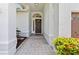 Inviting front entrance with tiled porch and decorative front door at 6051 65Th N Ave, Pinellas Park, FL 33781