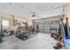 Spacious garage with weightlifting equipment, overhead door, and ample storage at 6051 65Th N Ave, Pinellas Park, FL 33781