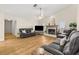 Inviting living room with a cozy fireplace and comfortable seating for the whole Gathering at 6051 65Th N Ave, Pinellas Park, FL 33781