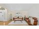 Inviting living room with hardwood floors, plush seating, and a bright window showcasing natural light and a cozy atmosphere at 6051 65Th N Ave, Pinellas Park, FL 33781