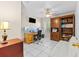 Home office space with desk, dual monitors, and built-in wooden bookcase at 6051 65Th N Ave, Pinellas Park, FL 33781