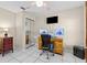 Comfortable home office space with desk setup, TV, and ample storage at 6051 65Th N Ave, Pinellas Park, FL 33781