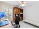 Home office featuring a built-in wooden bookcase, desk, and comfortable seating at 6051 65Th N Ave, Pinellas Park, FL 33781