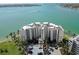 Beautiful waterfront condo building featuring manicured landscaping, private parking, and stunning views of the bay at 6105 Bahia Del Mar Cir # 682, St Petersburg, FL 33715