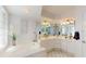Bright bathroom with a soaking tub, double vanity, and contemporary fixtures at 6105 Bahia Del Mar Cir # 682, St Petersburg, FL 33715