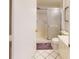 Cozy bathroom featuring a sliding shower door, toilet, vanity and tile flooring at 6105 Bahia Del Mar Cir # 682, St Petersburg, FL 33715