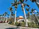 Tropical clubhouse surrounded by beautiful palm trees and landscaping at 6105 Bahia Del Mar Cir # 682, St Petersburg, FL 33715