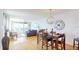 Bright dining room with modern light fixtures, seating, and water views at 6105 Bahia Del Mar Cir # 682, St Petersburg, FL 33715