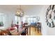 Bright dining room with modern light fixtures, seating, and beautiful water views at 6105 Bahia Del Mar Cir # 682, St Petersburg, FL 33715