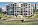 Luxury waterfront condo building featuring multiple balconies and beautifully landscaped grounds at 6105 Bahia Del Mar Cir # 682, St Petersburg, FL 33715