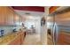 Kitchen featuring granite countertops, wooden cabinets and breakfast bar at 6105 Bahia Del Mar Cir # 682, St Petersburg, FL 33715