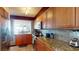 Fully equipped kitchen boasting stainless steel appliances, granite countertops and wood cabinets at 6105 Bahia Del Mar Cir # 682, St Petersburg, FL 33715