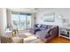 Bright living room with modern furnishings, balcony access, and water views at 6105 Bahia Del Mar Cir # 682, St Petersburg, FL 33715