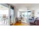 Bright living room featuring an open floor plan, water views, and balcony access at 6105 Bahia Del Mar Cir # 682, St Petersburg, FL 33715