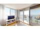 Bright living room with balcony access, modern furnishings, and water views at 6105 Bahia Del Mar Cir # 682, St Petersburg, FL 33715