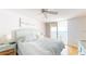 Inviting main bedroom with a ceiling fan, water view, and balcony access at 6105 Bahia Del Mar Cir # 682, St Petersburg, FL 33715