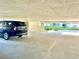 Well-lit parking garage area with car and ample space at 6105 Bahia Del Mar Cir # 682, St Petersburg, FL 33715