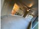 Spacious screened-in back porch with ceiling fans, concrete floor, and sliding glass doors into the house at 6153 La Pine Rd, Brooksville, FL 34602