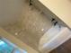 Bright bathroom features modern fixtures, a sleek bathtub, and beautiful stone-look tile at 6153 La Pine Rd, Brooksville, FL 34602