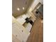 Well-lit kitchen with stainless steel appliances, white cabinets, granite countertops, and tile floors at 6153 La Pine Rd, Brooksville, FL 34602