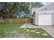 Charming home featuring a gray exterior, one car garage, and partially fenced yard at 6263 Oak Cluster Cir, Tampa, FL 33634