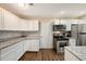 Modern kitchen with stainless steel appliances, granite countertops, and tile backsplash at 6263 Oak Cluster Cir, Tampa, FL 33634