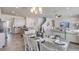 Open-concept living space featuring a kitchen, dining area, and living room, perfect for modern living at 6413 Gladeview Way, Land O Lakes, FL 34638