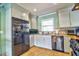 Well-equipped kitchen featuring stainless steel appliances, a double-door refrigerator, and bright natural light at 6912 14Th N St # 6912, St Petersburg, FL 33702