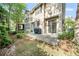 Backyard patio area with lush green space; perfect for outdoor entertaining at 7001 Interbay Blvd # 192, Tampa, FL 33616
