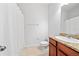 Bathroom featuring granite counters, wood cabinetry, toilet, and shower at 7001 Interbay Blvd # 192, Tampa, FL 33616