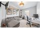 Bright bedroom with neutral carpet, ceiling fan, workspace, and a comfortable couch at 7001 Interbay Blvd # 192, Tampa, FL 33616