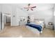 Spacious bedroom with carpet, ceiling fan, and windows for natural light at 7001 Interbay Blvd # 192, Tampa, FL 33616