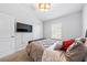 Comfortable bedroom with carpet, closet, and TV at 7001 Interbay Blvd # 192, Tampa, FL 33616