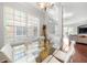 Bright dining area with a modern glass table and seating for six at 7001 Interbay Blvd # 192, Tampa, FL 33616