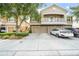 Charming townhome featuring a private balcony, stone accents, and a two-car garage at 7001 Interbay Blvd # 192, Tampa, FL 33616