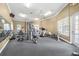 Community gym with mirrors, ceiling fans, and a variety of exercise equipment at 7001 Interbay Blvd # 192, Tampa, FL 33616