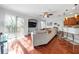 Cozy living room with hardwood floors and sliding doors to the outdoor area at 7001 Interbay Blvd # 192, Tampa, FL 33616