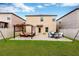 The backyard of the home has a seating area, dining table, and privacy fence at 7017 Gomez Rocks Ct, Sun City Center, FL 33573