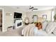 Spacious bedroom with a fireplace, accent chairs, and lots of natural light at 7017 Gomez Rocks Ct, Sun City Center, FL 33573