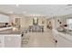 Open concept dining room featuring a modern chandelier and seating for six guests at 7017 Gomez Rocks Ct, Sun City Center, FL 33573