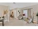 Open living room with neutral tones, tile flooring and contemporary decor at 7017 Gomez Rocks Ct, Sun City Center, FL 33573