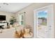 Bright living room with a comfortable sofa, natural light and sliding door to the backyard at 7017 Gomez Rocks Ct, Sun City Center, FL 33573