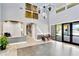 Bright lobby featuring tile floors, elegant lighting, and comfortable seating near the entrance to the outdoor pool area at 7017 Gomez Rocks Ct, Sun City Center, FL 33573