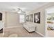 Comfortable loft space with a sofa, fireplace, and artwork on the walls at 7017 Gomez Rocks Ct, Sun City Center, FL 33573