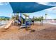 Community playground featuring a variety of equipment, providing a safe and fun space for children to play and exercise at 7017 Gomez Rocks Ct, Sun City Center, FL 33573