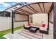 Covered patio seating area with cushioned furniture, a rug, and a glass table at 7017 Gomez Rocks Ct, Sun City Center, FL 33573