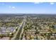 Expansive aerial view showcases a neighborhood with a canal running through a residential community at 7676 18Th St N, St Petersburg, FL 33702