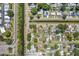 Overhead shot of homes with pools, solar panels and a canal, nestled in a Gathering-friendly neighborhood at 7676 18Th St N, St Petersburg, FL 33702