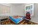 Spare bedroom with Spider-Personal bedding, a window with natural light, and a modern desk and chair at 7676 18Th St N, St Petersburg, FL 33702